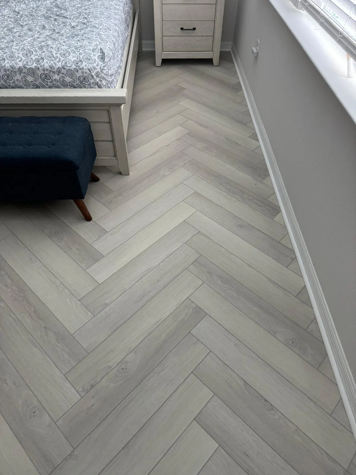 Laminate wood-look flooring in a modern bedroom