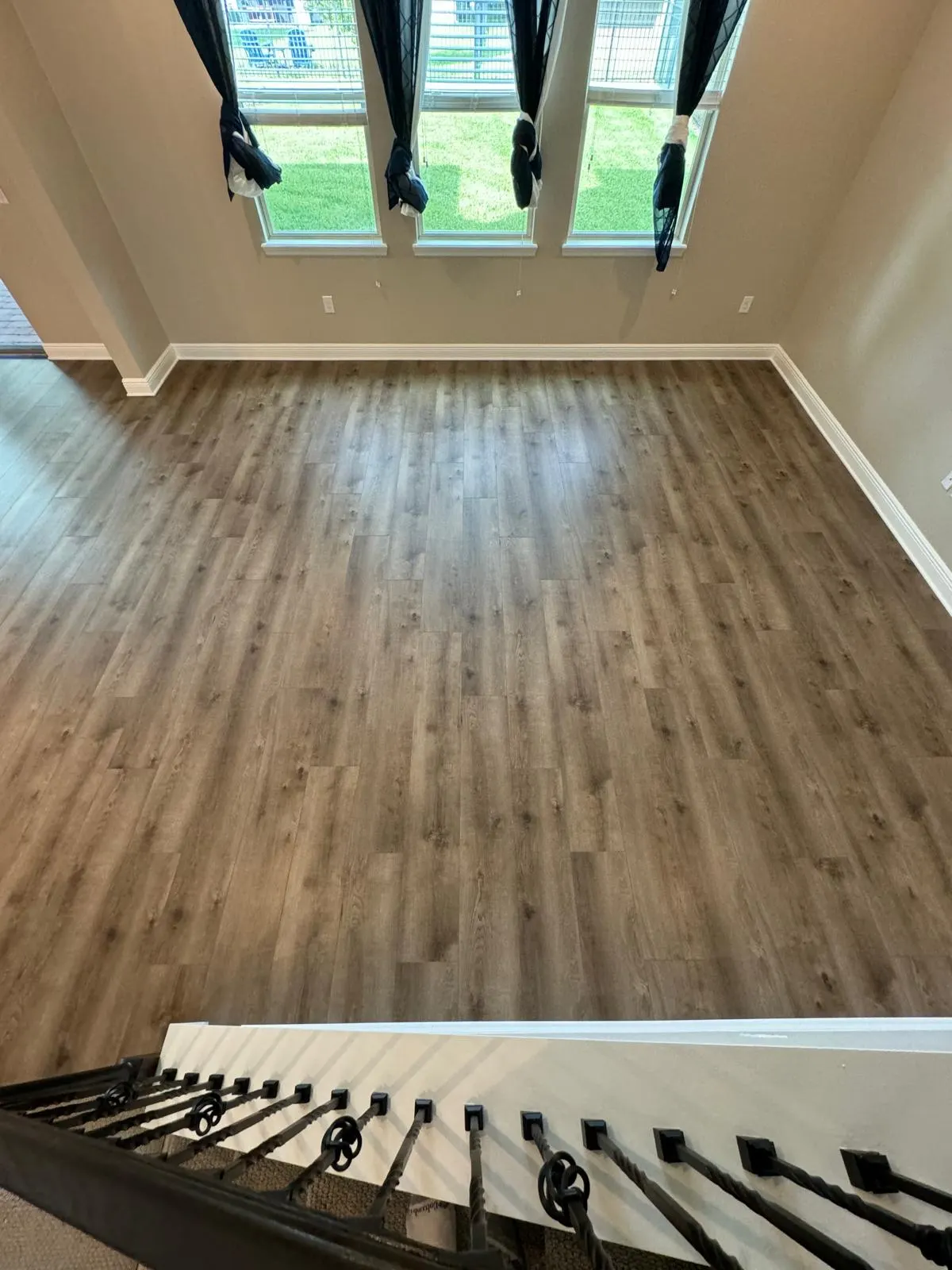 Wide-plank wood-look flooring in a bright room